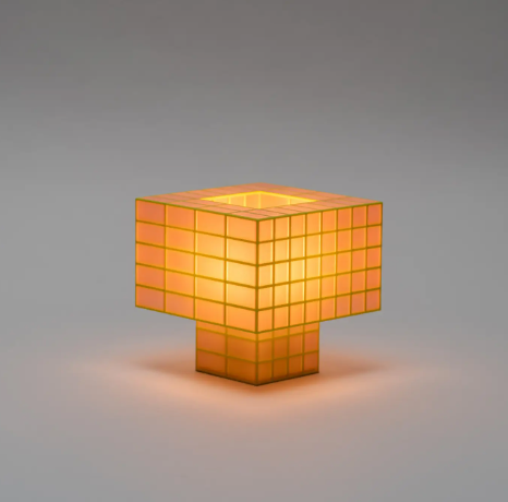 Showcase the compact Tesser 5:3 Lamp by Ridezign in guava, highlighting its cube-like proportions and grid structure.