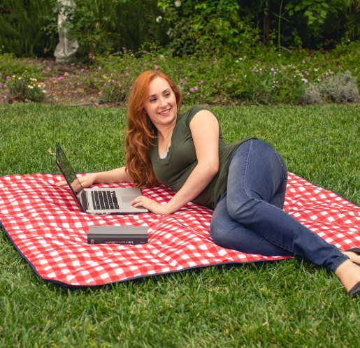 Capture serene moments outdoors with this durable red and white checkered blanket, ideal for everything from leisurely picnics to a refreshing al fresco workspace.