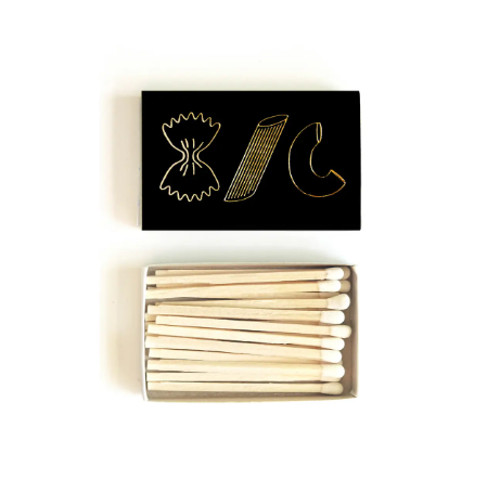 The Pasta Trio Matchbox, showcasing gold embossed farfalle, penne, and maccheroni on a black background.