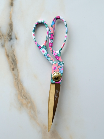 Upgrade your workspace with these stylish designer scissors featuring a vibrant floral pattern and gleaming gold blades, perfect for effortless gift wrapping.