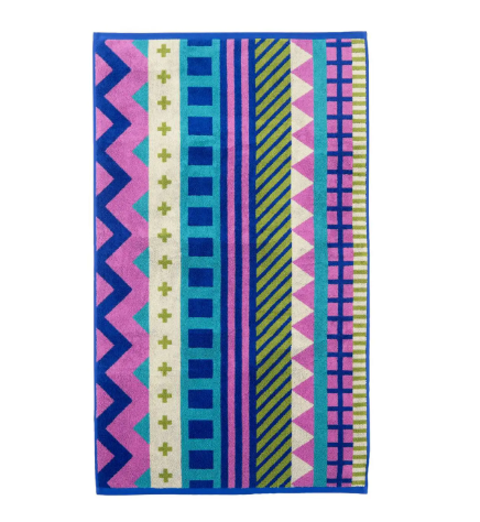 A vibrant jacquard bath towel featuring a colorful pattern of bold stripes, chevrons, and geometric shapes.