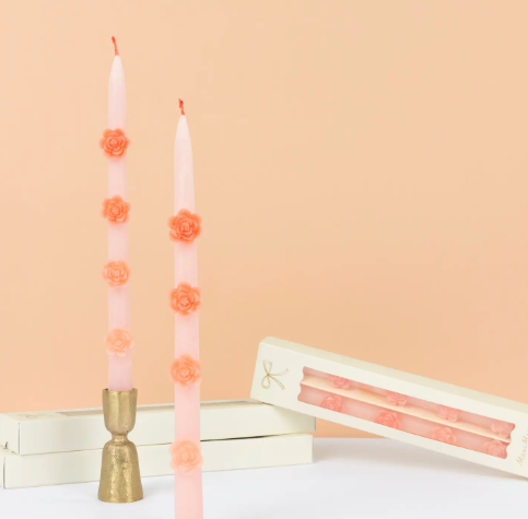Artisanal fragrance-free pink candles with delicate wax floral details, made by Meri Meri for home decor and gifting.