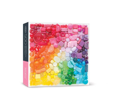 A 500-piece artist series puzzle by Fred & Friends featuring Sugar Spectrum, vibrant artwork and thick ribbon-cut pieces.