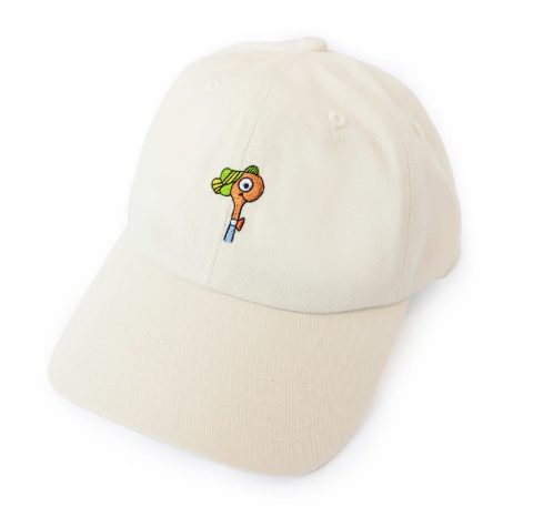 The Three Potato Four Lowly Worm Dad Hat, showcasing its ivory color and the whimsical embroidered character detail.