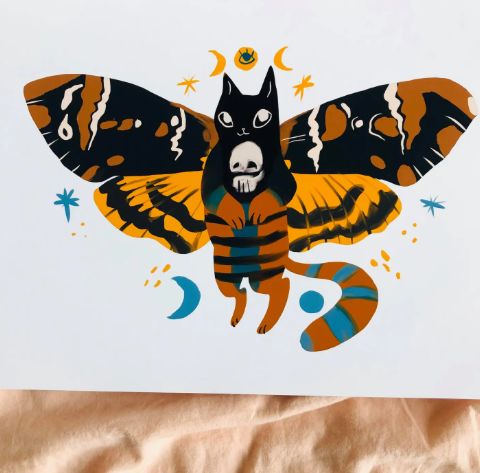 A spooky art print featuring the Hades Cat Moth with colorful wings, ready to bring charm and whimsy to your home decor.