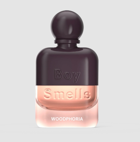 The Boy Smells Woodphoria perfume bottle in a deep aubergine and pink dual-toned shade.