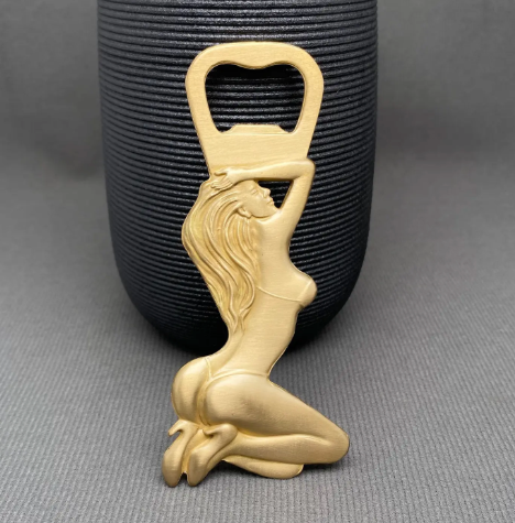View the highly detailed reverse side of a solid brass pin-up bottle opener showing long flowing hair standing against a dark grey textured background.