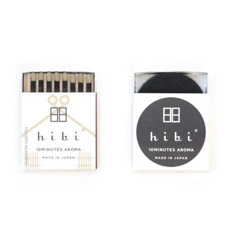 Japanese cypress hibi incense matches shown next to its aesthetic minimalist box by Ameico.