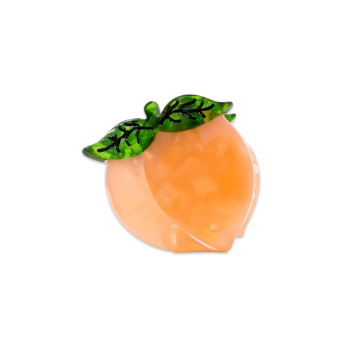 A shimmering iridescent Mini Peach Hair Claw by Jenny Lemons, showcasing its sweet peach shape and vibrant color, ready to add a charming touch to your hair.