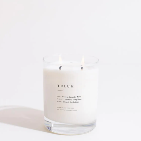 Infuse a calming coastal ambiance into your bedroom or living area with an elegant, clear-glass double-wick luxury candle featuring clean typography.
