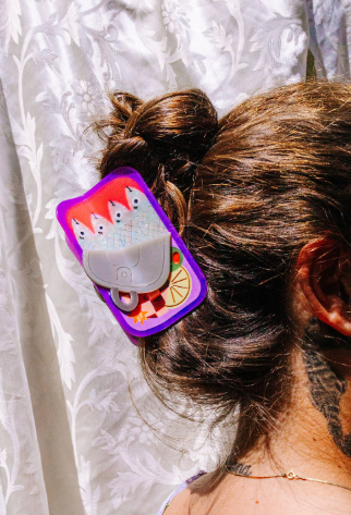 Unique sardine tin hair clip designed in San Francisco, perfect for adding a whimsical "cool girl" touch to any hairstyle.