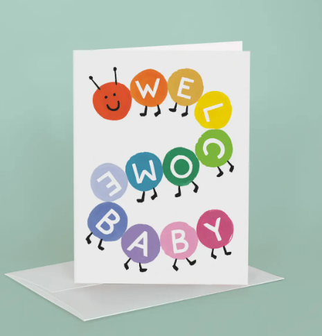 Welcome the newest addition to the family with this delightful baby greeting card featuring a colorful, hand-painted caterpillar spelling out a sweet congratulatory message.