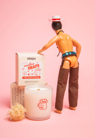 Experience the Stampede year-round with Milkjar's Assless Chaps Saddle Leather Candle. Hand-poured in Calgary, this coconut soy candle features a wooden wick and a cause you can feel good about.