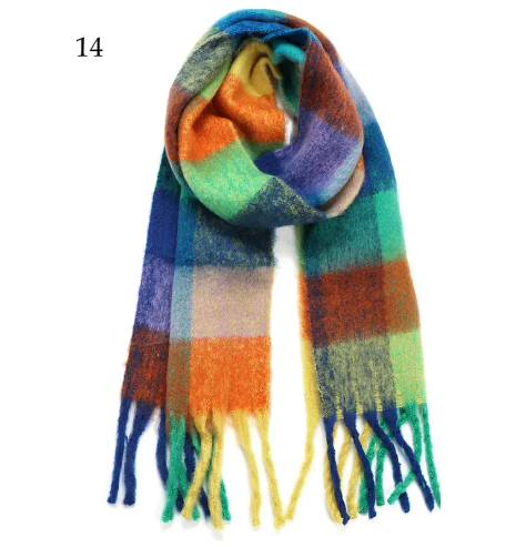 A chunky oblong plaid scarf in a stylish purple and green color combination.