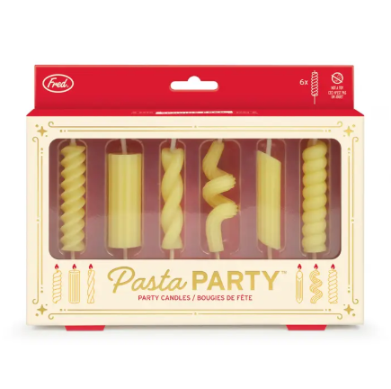 The colorful window box packaging for the Pasta Party Noodle Candles by Fred & Friends, showcasing gold foil accents and a fun red-and-white display.
