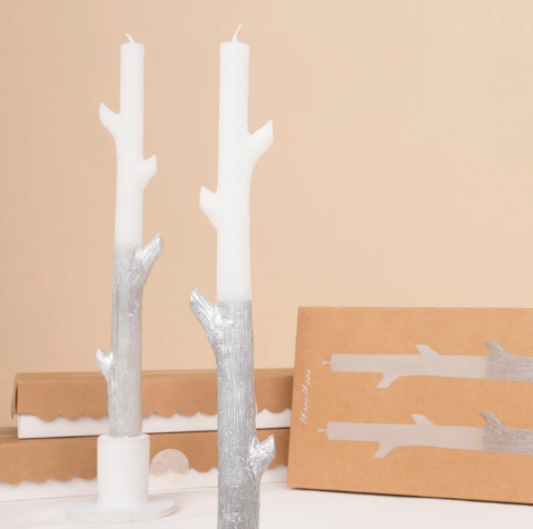 A set of two unscented silver and white taper candles, ideal for winter wonderland or sophisticated Halloween table settings.