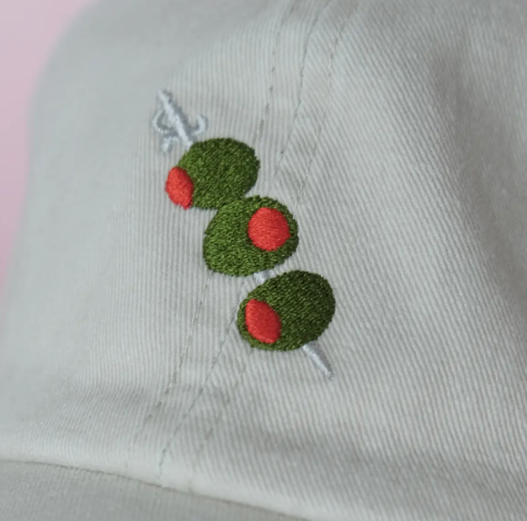 A close-up shot of the embroidery on the olives, highlighting the intricate details of the design.