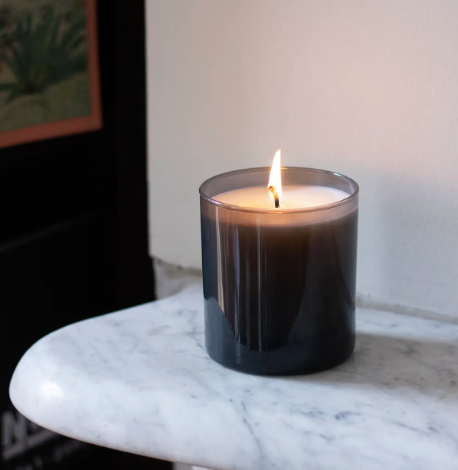 A close-up shot of the Storm candle lit up, highlighting the premium design and modern aesthetic.