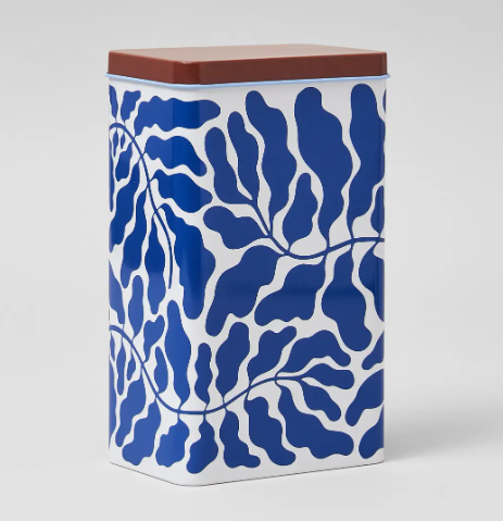 The Leaves Kitchen Storage Tin by Wrap featuring a vibrant blue leaf pattern and a cobalt blue scoop.