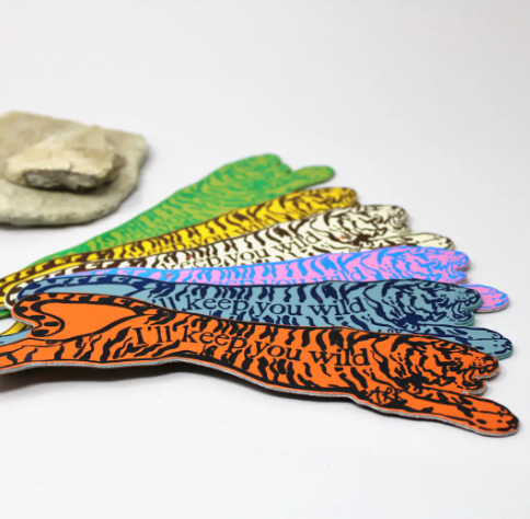 A handcrafted Scottish leather bookmark with a bold tiger motif and high-impact foil detailing