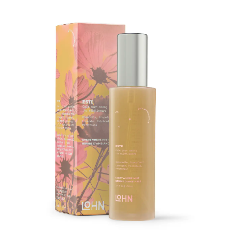 Elevate your self-care ritual with a beautifully packaged all-natural wellness spray featuring vibrant botanical illustrations.