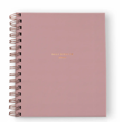A beautiful dusty rose daily planner with chic gold foil details, ready to help you plan your most intentional life.