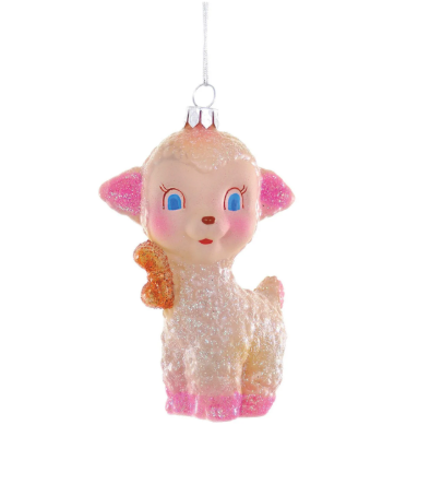 A pink and white glass Little Lamb Ornament with glitter accents and big blue eyes, holding one hoof up.