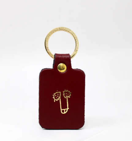 Oxblood leather willy keyring with a gold-plated ring, a humorous and high-quality novelty keychain.