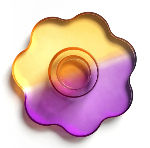Close up of the Nimbus durable acrylic candlestick holder featuring a stylish orange, purple dual-toned design.