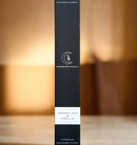 Hand-dipped charcoal incense sticks by Moonstone Rituals in Smoked Oud & Vanilla, showing the eco-friendly tray-style packaging.