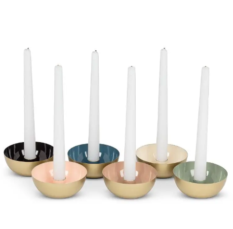 Elegant artisanal candle stand made in India, perfect for adding a warm glow to a dining table.