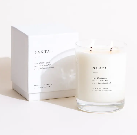 The elegant Brooklyn Candle Studio Santal Classic 2-Wick Candle next to its minimalist white box, featuring a woodsy scent.