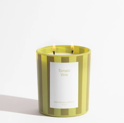 Brighten up your favorite room with a fresh summer fragrance using a clean-burning double-wick soy candle poured into a playful olive and chartreuse striped glass.