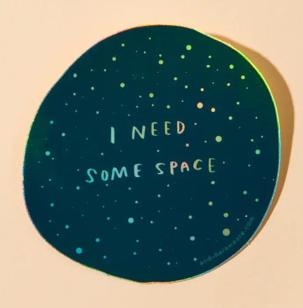 Personalize your accessories with the holographic I Need Some Space sticker by And Here We Are, featuring a deep space galaxy design and playful typography.