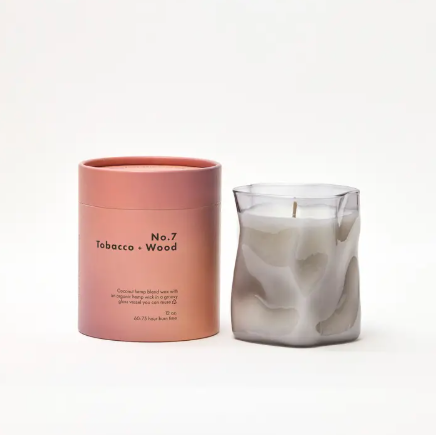 No. 7 Tobacco + Wood Candle by Choice Blooms in its transparent gray glass vessel and now in 12oz. size.