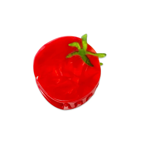 A whimsical hair claw shaped like a mini tomato, with hand-painted details and a glossy finish.