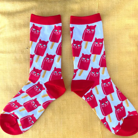Catsicle Socks featuring red cat-shaped popsicles on a blue background with red accents.