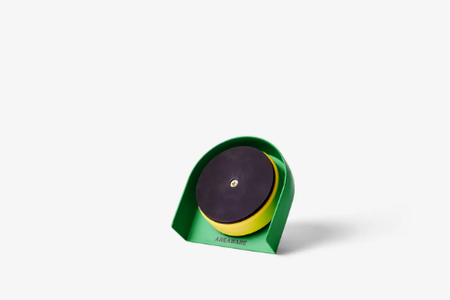 A colorful, cylindrical kitchen timer with a magnetic back.