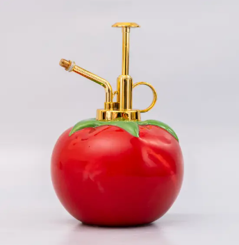 Add a pop of garden-inspired fun to your plant collection with the Ban.do Ceramic Tomato Plant Mister, featuring a playful design and sleek gold pump.