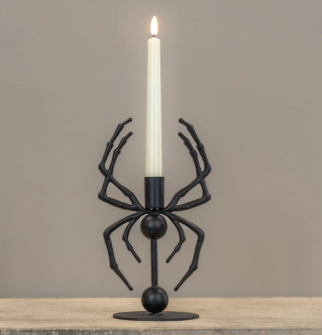Add gothic charm to your tabletop with the 10.25-inch Spider Taper Candle Holder by Ragon House, crafted with intricate spider legs for a hauntingly stylish look.