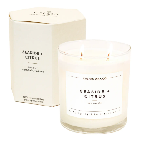 The elegant Seaside + Citrus candle in its custom gift-ready hexagon box, highlighting its high-end presentation and thoughtful design.