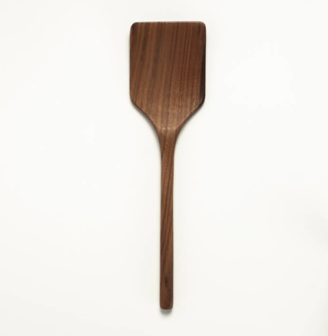 A handcrafted 12 inch walnut wooden spatula by JBrody and Co with a rich dark wood grain and smooth finish.