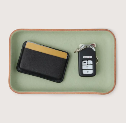 A minimalist small Aloe green catchall tray showcasing the premium hand-sculpted leather craftsmanship of Graf Lantz.