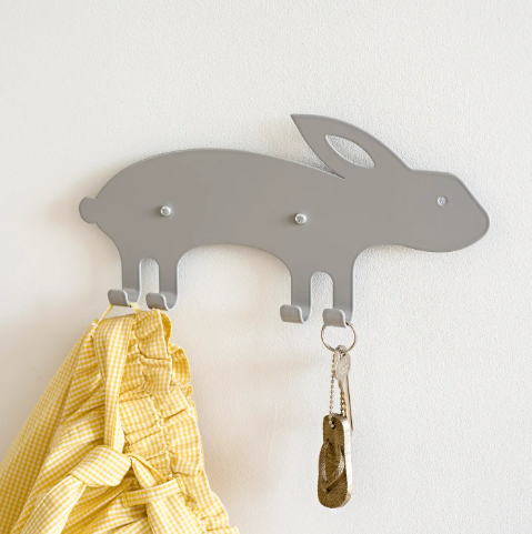 A minimalist grey rabbit-shaped wall hook, highlighting its sleek profile and functional design.