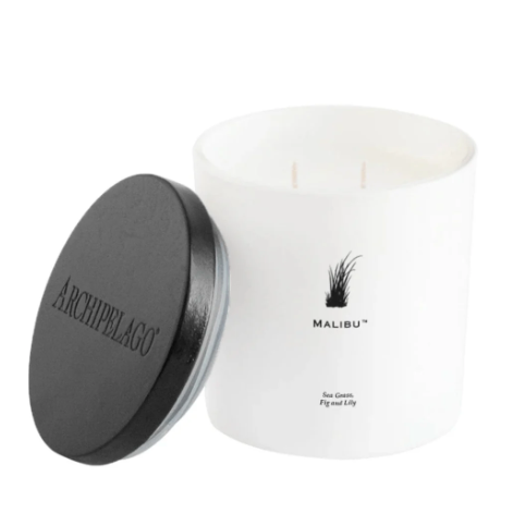 A minimalist Malibu Luxe Candle with sea grass and fig notes, perfect for a sophisticated coastal home aesthetic.