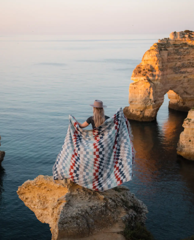 Close-up of the Checkered Oceanside Fall Throw Blanket, highlighting its intricate texture and recycled material blend.