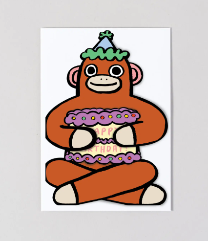 An adorable children's birthday card featuring a sock monkey holding a mini birthday message.