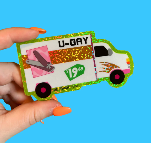 The Peach Fuzz's "U-Gay Moving Truck" glitter sticker, highlighting its playful design, sparkling accents, and the "U-GAY" text.