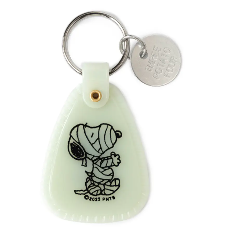 Add retro charm to your keys with the glow-in-the-dark Snoopy Mummy Saddle Keychain by Three Potato Four, featuring a vintage mummy illustration.