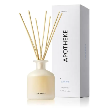 APOTHEKE Canvas Reed Diffuser set featuring a frosted translucent glass bottle filled with oil and a bundle of natural rattan reeds.